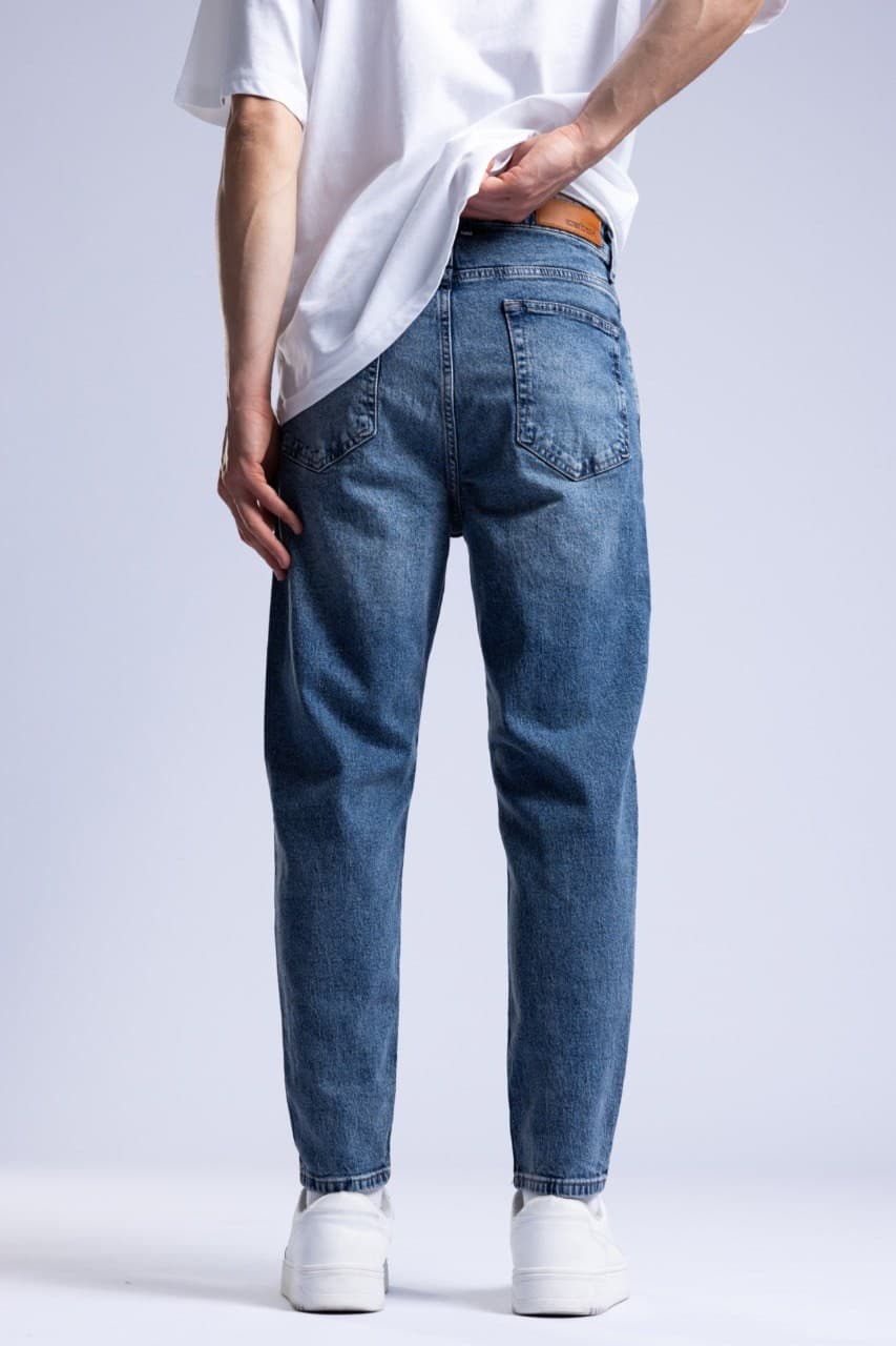 Classic Blue Wash Denim Boyfriend Jeans - Classic blue wash denim jeans crafted with a slim straight fit for a clean modern look. Features a soft faded finish, mid-rise waist, and timeless five-pocket design for everyday comfort and style. Perfect to pair with oversized tees, shirts, or sneakers for an effortless casual outfit.