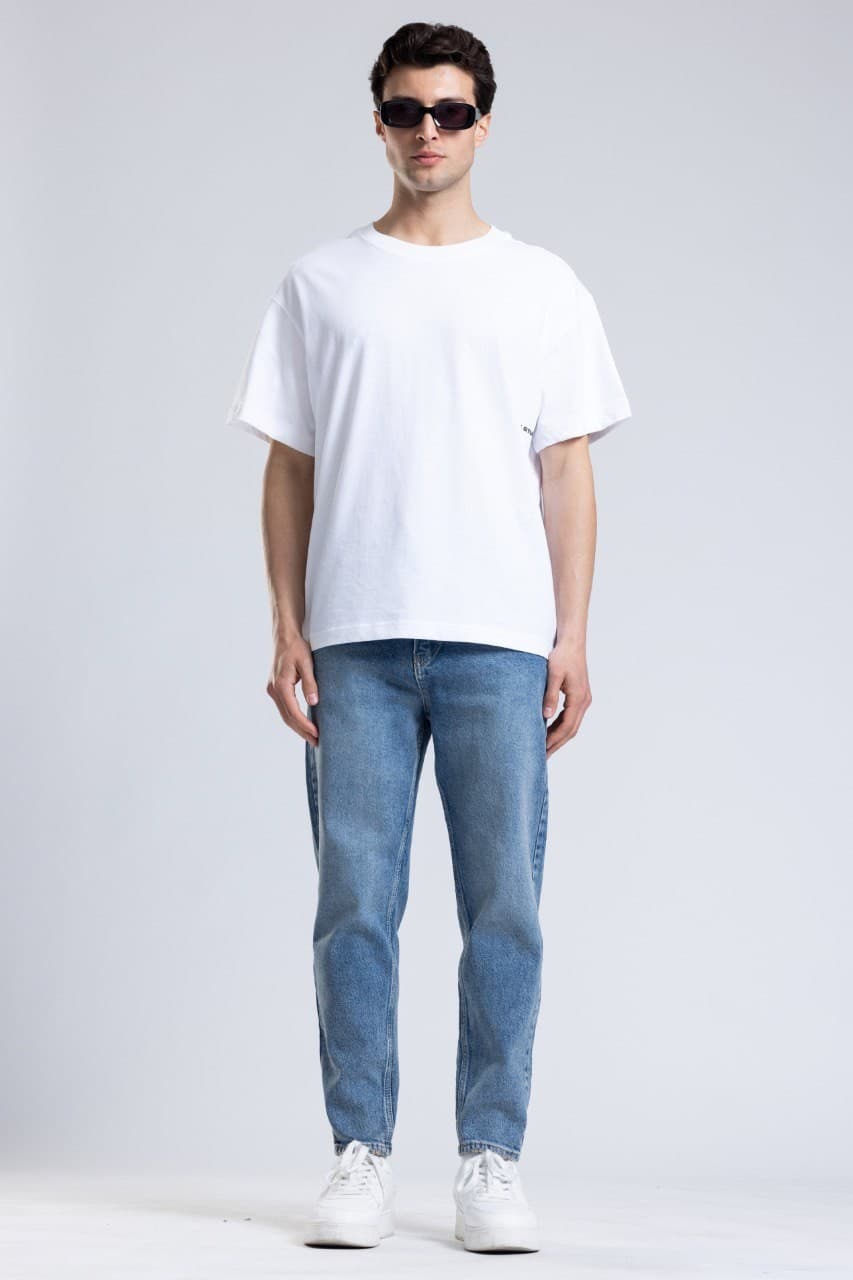 Denim Boyfriend Jeans - Light blue wash denim jeans designed with a slim straight fit for a clean everyday style. Features a soft faded finish, mid-rise waist, and classic five-pocket construction for lasting comfort. Easy to pair with tees, hoodies, or sneakers for a fresh casual streetwear look.