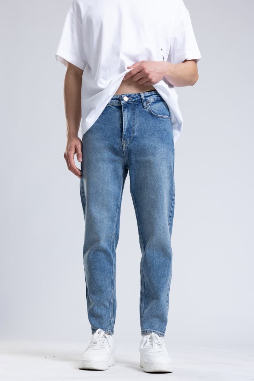 Denim Boyfriend Jeans - Light blue wash denim jeans designed with a slim straight fit for a clean everyday style. Features a soft faded finish, mid-rise waist, and classic five-pocket construction for lasting comfort. Easy to pair with tees, hoodies, or sneakers for a fresh casual streetwear look.