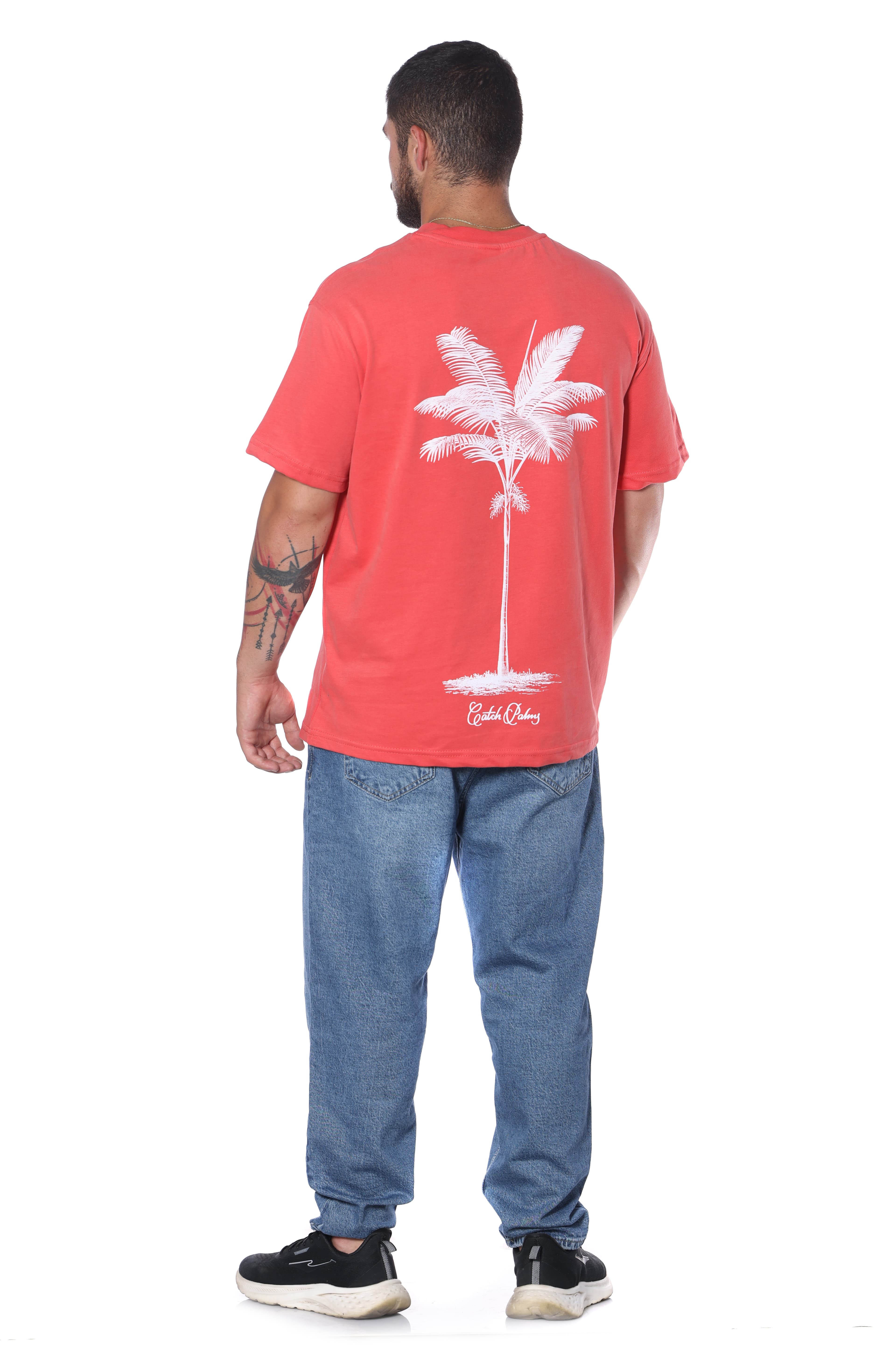 Catch Palmy Oversized T-Shirt - Oversized t-shirt featuring a clean white script logo on the front and bold palm tree graphic on the back. Made with a relaxed fit and soft cotton feel for all-day comfort. Perfect for casual streetwear looks, summer outfits, and everyday styling.
