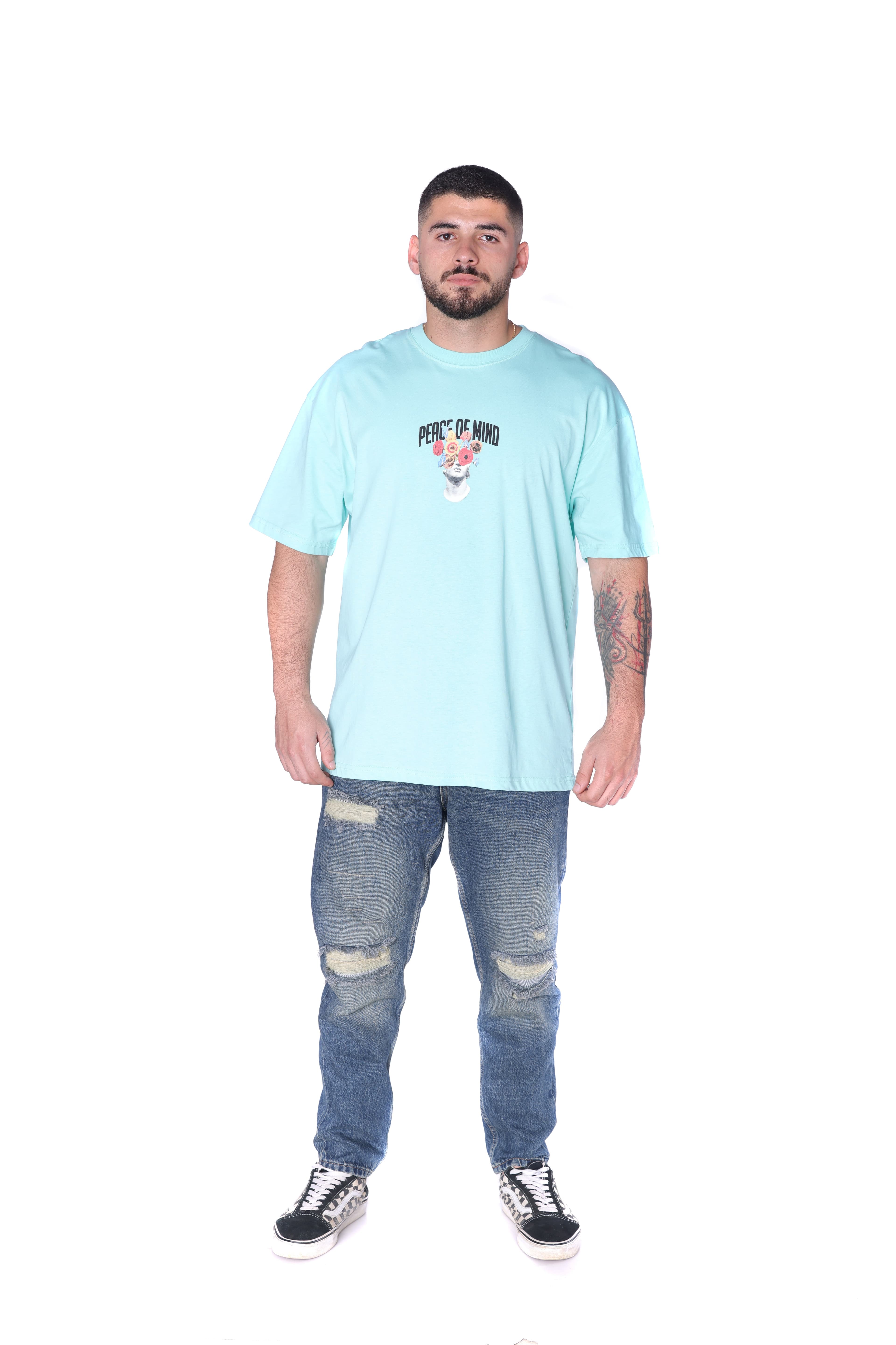 Light Aqua Oversized Floral T-Shirt - Oversized light aqua t-shirt featuring a minimal front chest graphic and bold statement artwork on the back with floral statue design and Peace of Mind lettering. Crafted from soft breathable fabric with a relaxed fit for everyday comfort. A fresh streetwear essential perfect for casual styling and standout summer looks.