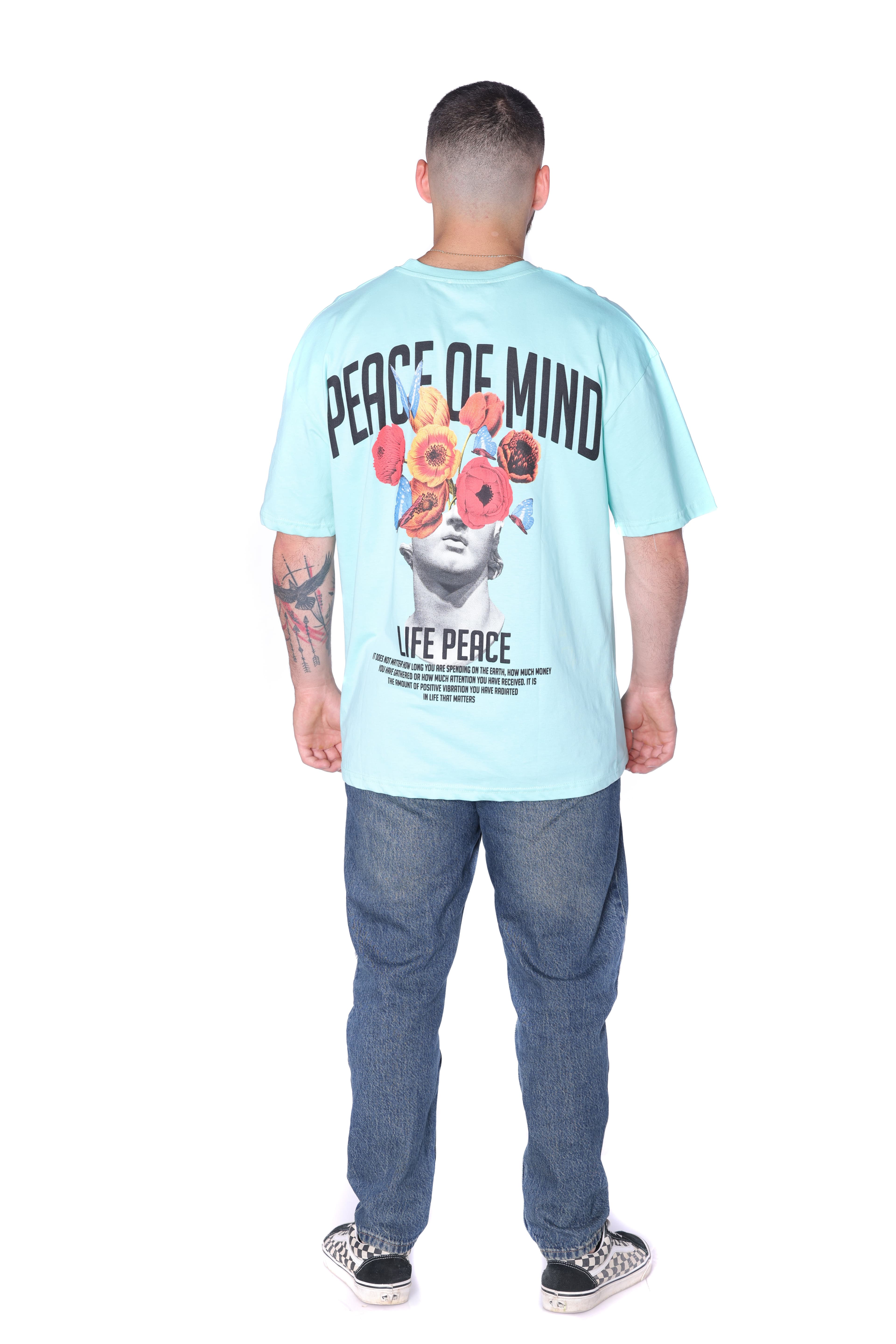Light Aqua Oversized Floral T-Shirt - Oversized light aqua t-shirt featuring a minimal front chest graphic and bold statement artwork on the back with floral statue design and Peace of Mind lettering. Crafted from soft breathable fabric with a relaxed fit for everyday comfort. A fresh streetwear essential perfect for casual styling and standout summer looks.