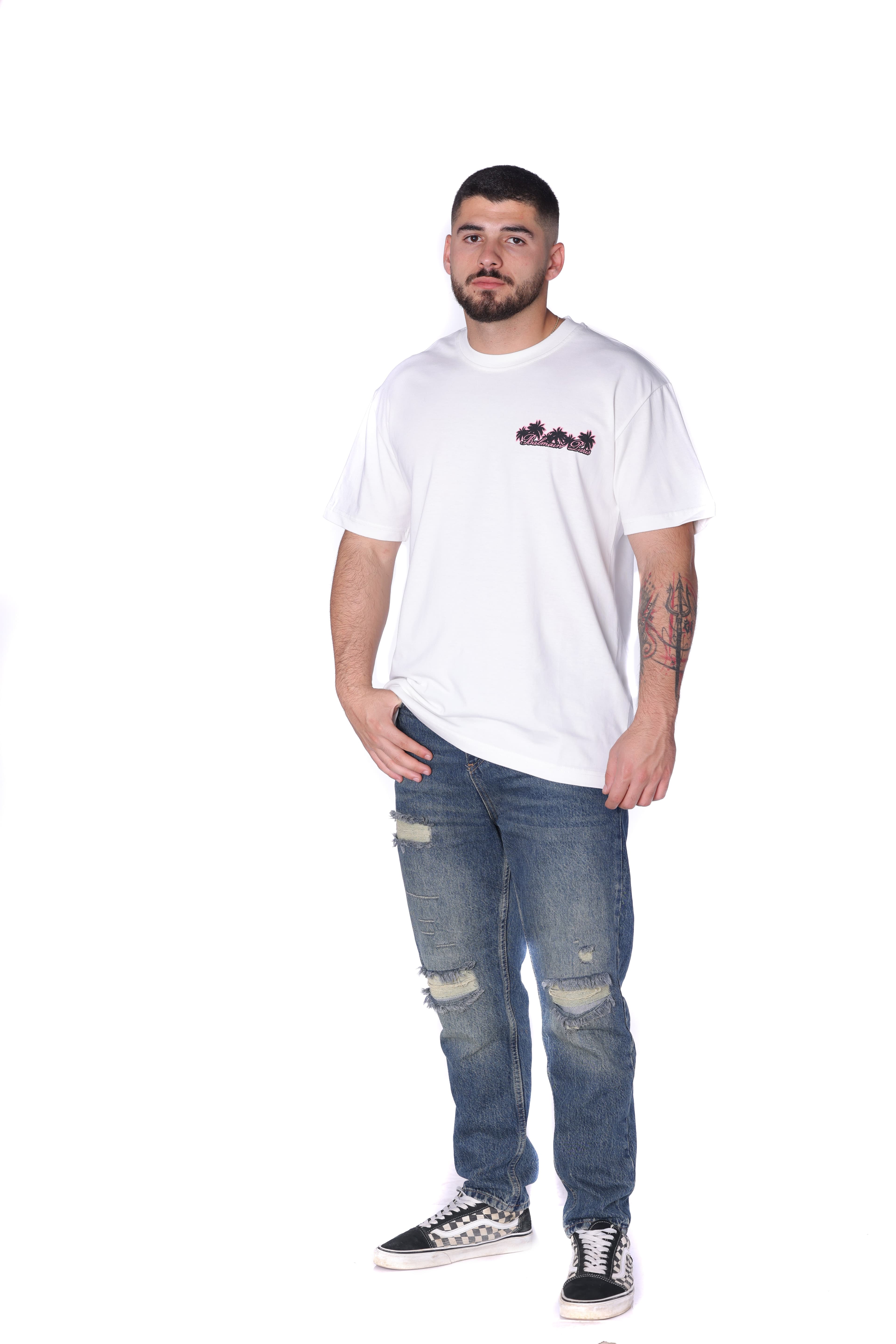 White Balmain Club Oversized T-Shirt - Premium white oversized t-shirt featuring a minimal front chest logo and bold Balmain Club Paris-inspired artwork on the back with tropical sunset design details. Made from soft breathable fabric with a relaxed fit for everyday comfort. A standout luxury streetwear piece perfect for summer outfits, casual styling, and elevated everyday wear.