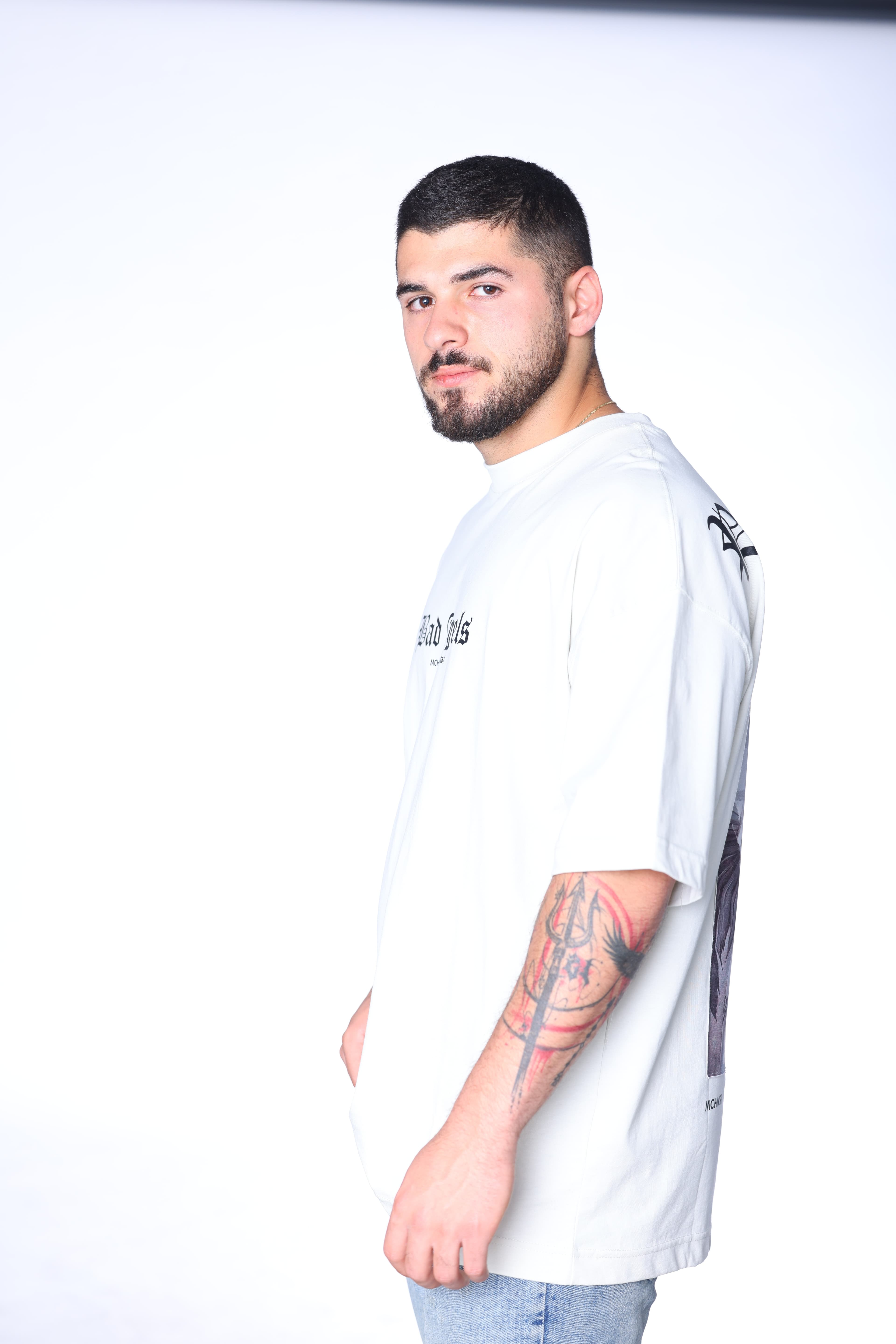 Oversized Ice Grey Bad Angels T-Shirt - Oversized ice grey t-shirt featuring bold Bad Angels gothic text on the front with statement graphic detailing on the back. Crafted from soft premium fabric with a relaxed fit for all-day comfort. A clean modern streetwear essential perfect for casual styling, layered outfits, and everyday wear.