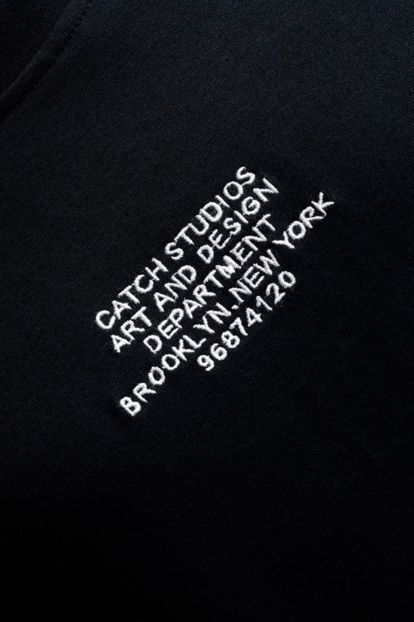 Oversized Black T-Shirt Catch Studios - Oversized black t-shirt featuring clean embroidered front text detail for a minimal premium look. Crafted from soft breathable fabric with a relaxed fit for all-day comfort. A timeless streetwear essential perfect for casual outfits, layered styling, and everyday wear.