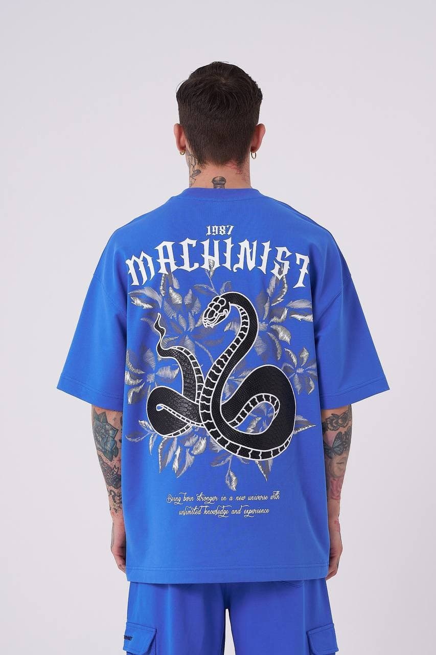 Oversized Electric Blue Snake T-Shirt - Oversized electric blue t-shirt featuring a minimal front chest print and bold back graphic with gothic Machinist lettering, snake artwork, and statement detailing. Crafted from soft premium fabric with a relaxed fit for all-day comfort. A standout streetwear piece perfect for bold casual looks, coordinated outfits, and everyday wear.