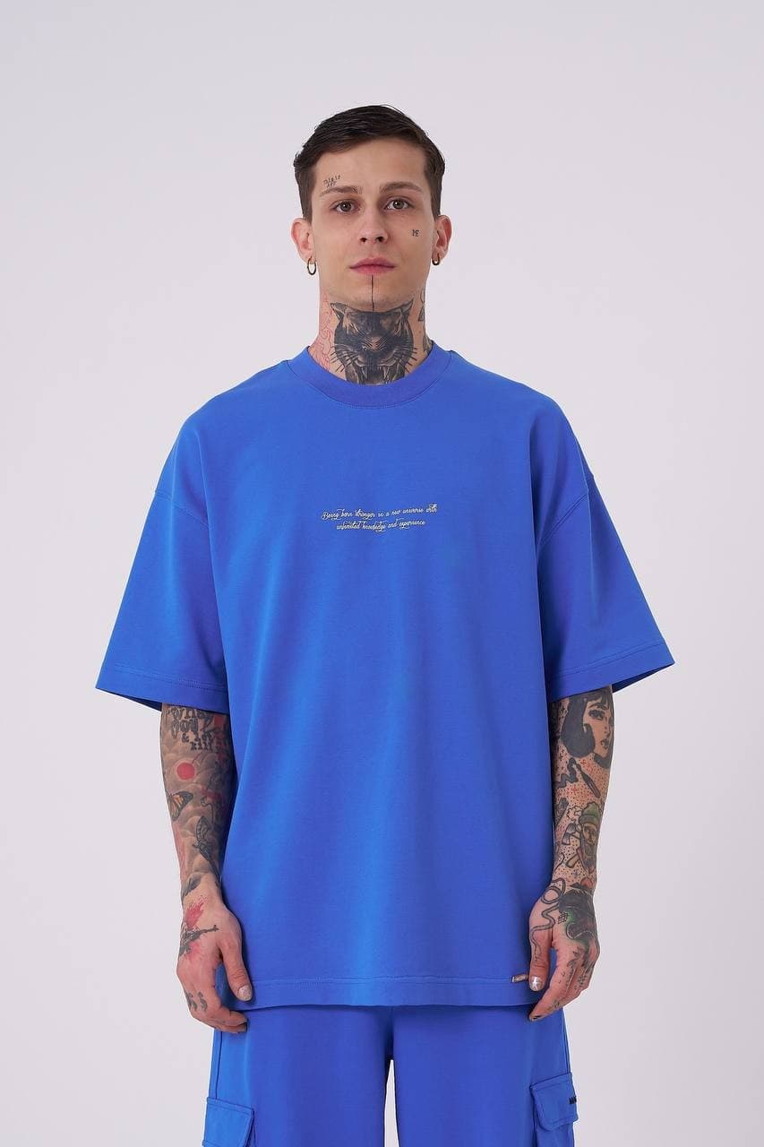 Oversized Electric Blue Snake T-Shirt - Oversized electric blue t-shirt featuring a minimal front chest print and bold back graphic with gothic Machinist lettering, snake artwork, and statement detailing. Crafted from soft premium fabric with a relaxed fit for all-day comfort. A standout streetwear piece perfect for bold casual looks, coordinated outfits, and everyday wear.
