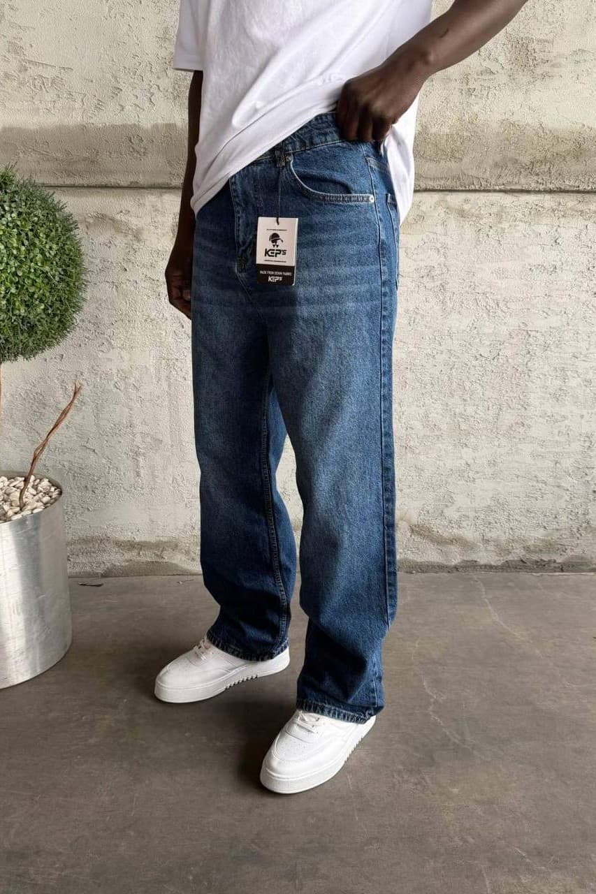 Relaxed Fit Baggy Jeans - Relaxed fit baggy jeans in a light blue washed denim finish, designed with a loose straight-leg silhouette for a clean streetwear look. Crafted from durable premium denim with classic five-pocket styling and a comfortable everyday fit. Perfect for sneakers, oversized tees, and casual urban outfits.