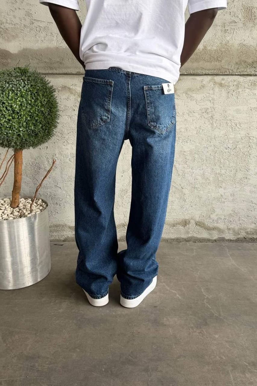Relaxed Fit Baggy Jeans - Relaxed fit baggy jeans in a light blue washed denim finish, designed with a loose straight-leg silhouette for a clean streetwear look. Crafted from durable premium denim with classic five-pocket styling and a comfortable everyday fit. Perfect for sneakers, oversized tees, and casual urban outfits.