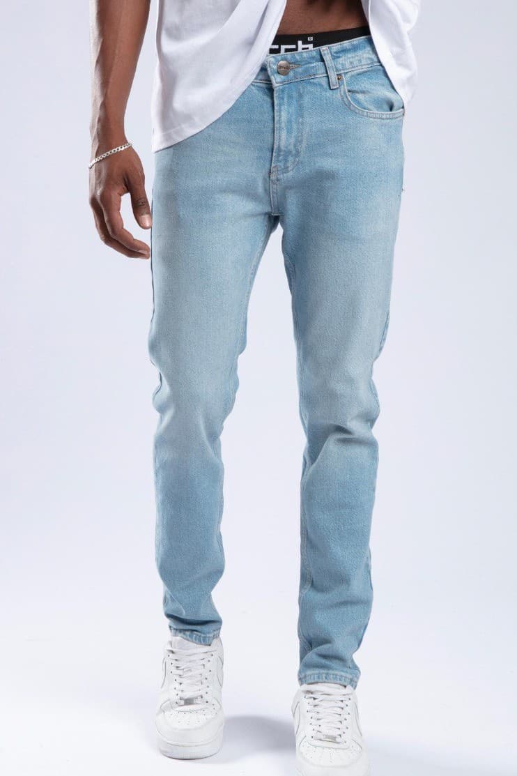 Ice Blue Denim Jeans - Slim fit jeans in an ice blue washed denim finish, designed with a clean tapered silhouette for a sharp everyday look. Crafted from comfortable premium denim with classic five-pocket styling and a modern streamlined fit. Perfect to pair with sneakers, tees, or jackets for a fresh casual outfit.
