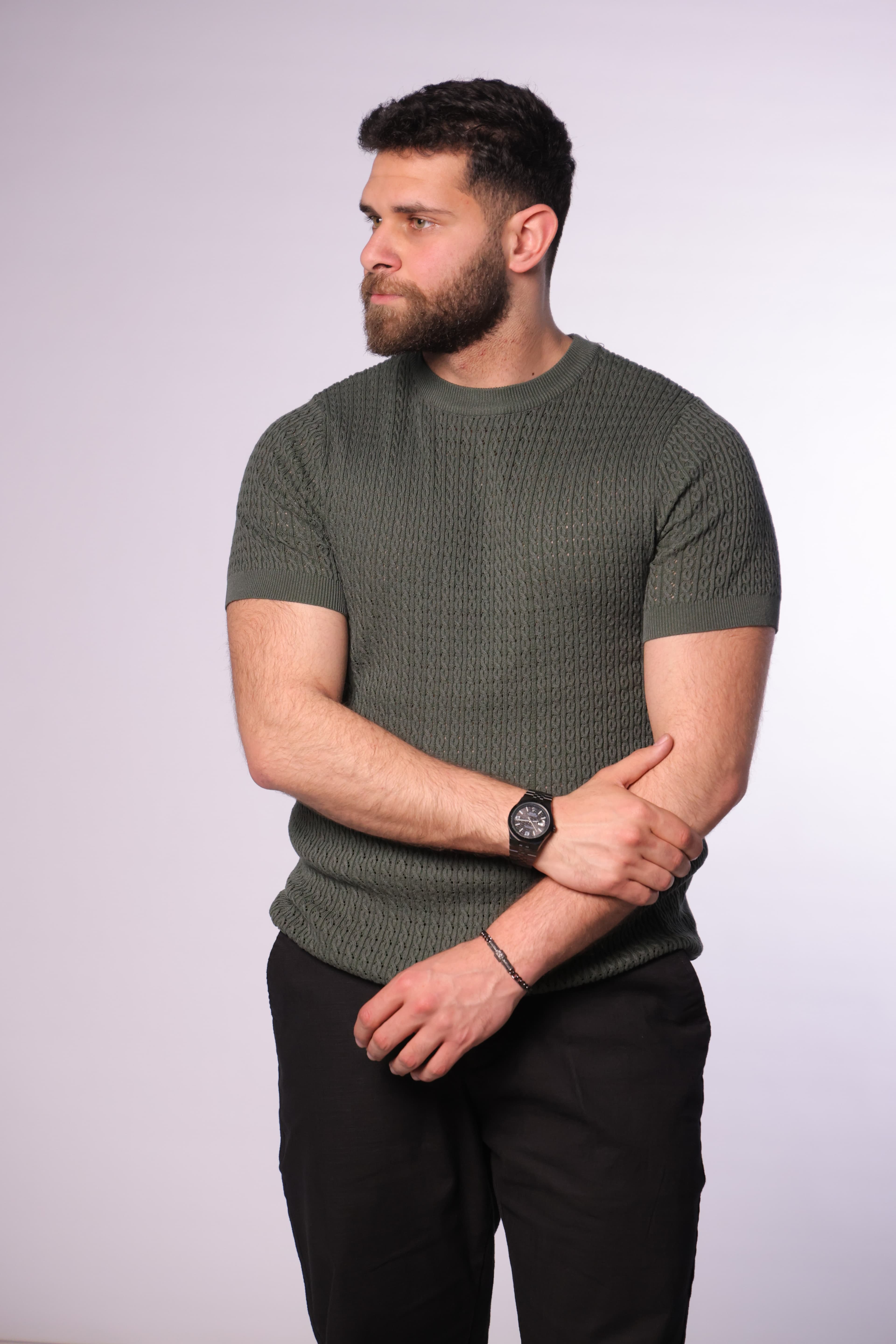 Slim-Fit Knit T-Shirt - Slim-fit textured knit t-shirt in a refined olive green tone, featuring a subtle patterned weave for a premium look. Designed with a clean crew neckline and tailored sleeves that enhance the silhouette. Made from soft, breathable fabric, perfect for smart-casual outfits or elevated everyday wear.