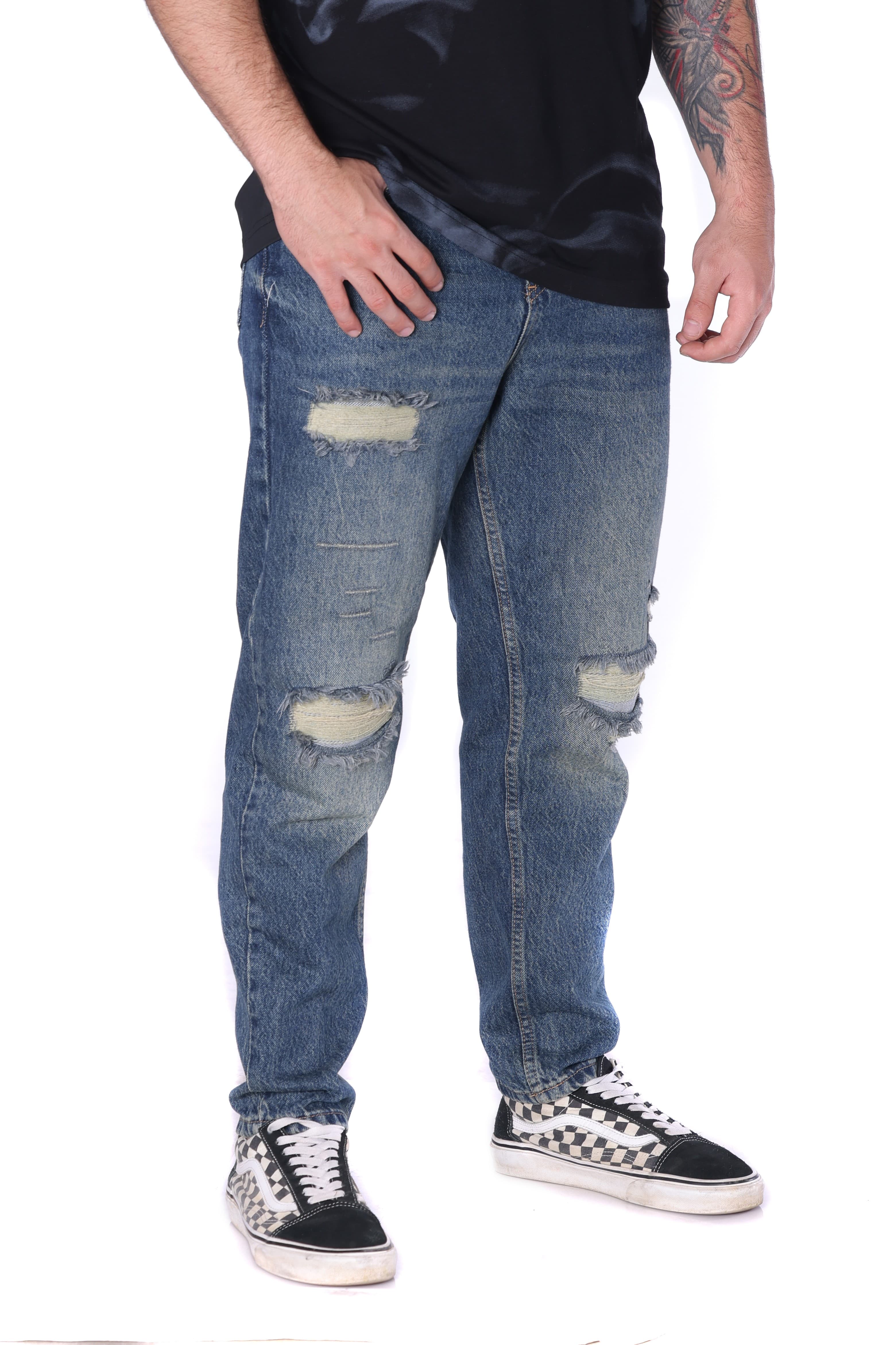 Boyfriend Blue Ripped Denim Jeans - Relaxed-fit boyfriend blue denim jeans with a worn-in vintage wash, featuring distressed details and ripped accents for a bold streetwear look. Designed with a cut that offers comfort and a slightly loose silhouette. Crafted from durable denim with a soft feel, making them perfect for everyday wear and easy to style with tees and sneakers for an effortless urban vibe.