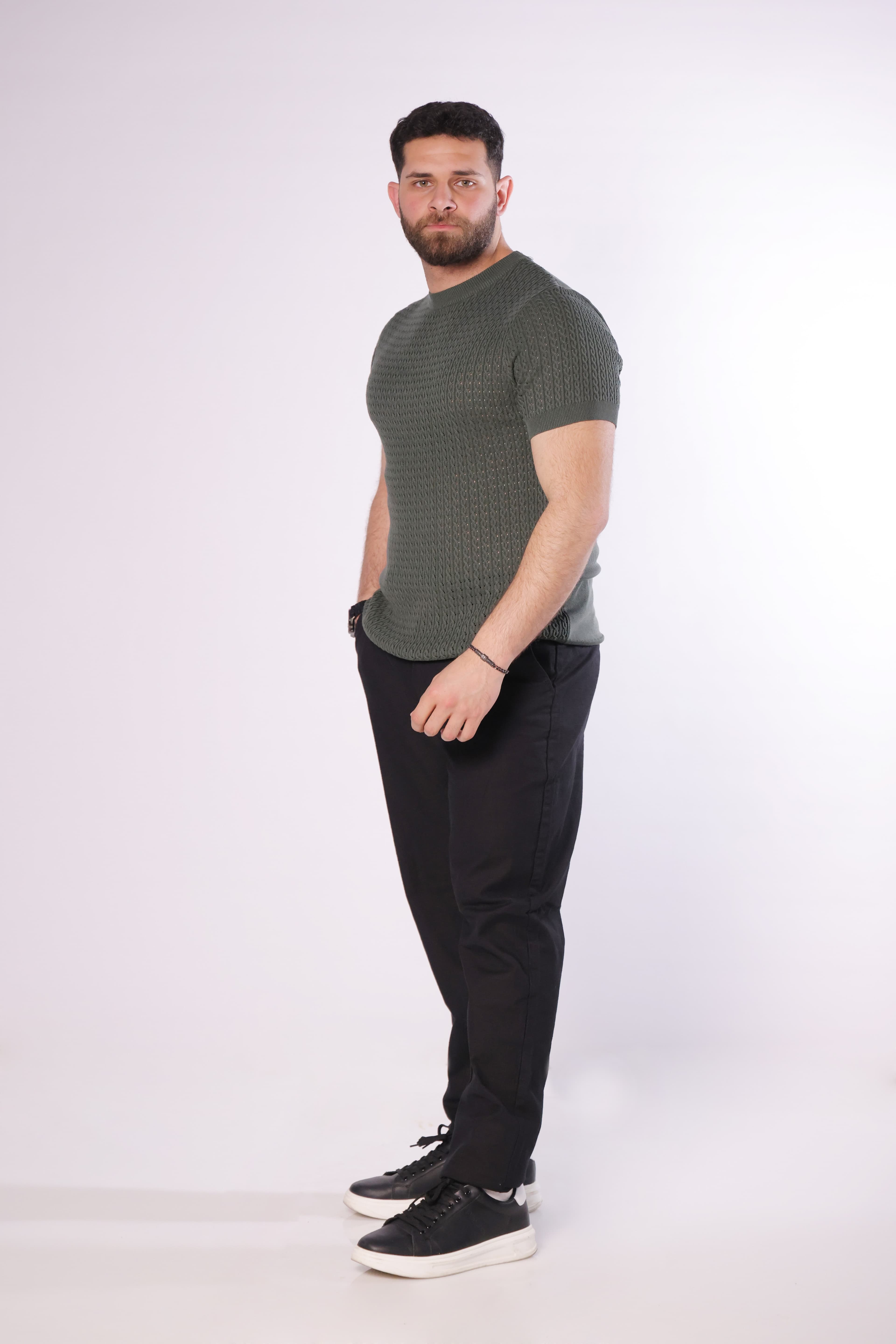 Slim-Fit Knit T-Shirt - Slim-fit textured knit t-shirt in a refined olive green tone, featuring a subtle patterned weave for a premium look. Designed with a clean crew neckline and tailored sleeves that enhance the silhouette. Made from soft, breathable fabric, perfect for smart-casual outfits or elevated everyday wear.