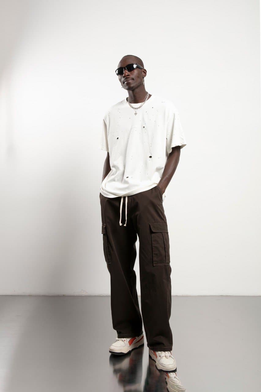 Oversized Ripped Tshirt - Oversized off-white t-shirt featuring a distressed design with subtle ripped details for a raw, edgy streetwear look. Crafted with a relaxed drop-shoulder fit and loose silhouette for maximum comfort. Made from soft, breathable fabric—perfect for casual everyday styling with a bold, worn-in vibe.