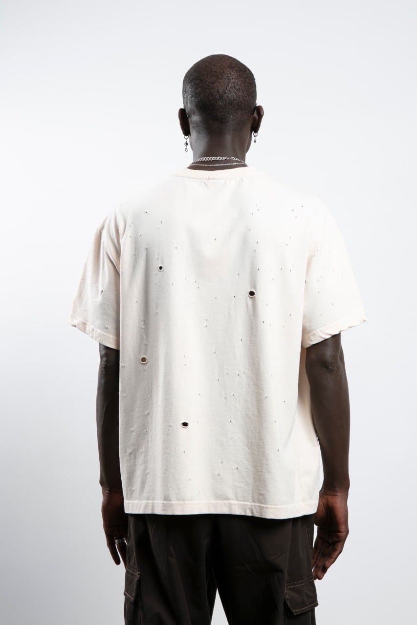 Oversized Ripped Tshirt - Oversized off-white t-shirt featuring a distressed design with subtle ripped details for a raw, edgy streetwear look. Crafted with a relaxed drop-shoulder fit and loose silhouette for maximum comfort. Made from soft, breathable fabric—perfect for casual everyday styling with a bold, worn-in vibe.