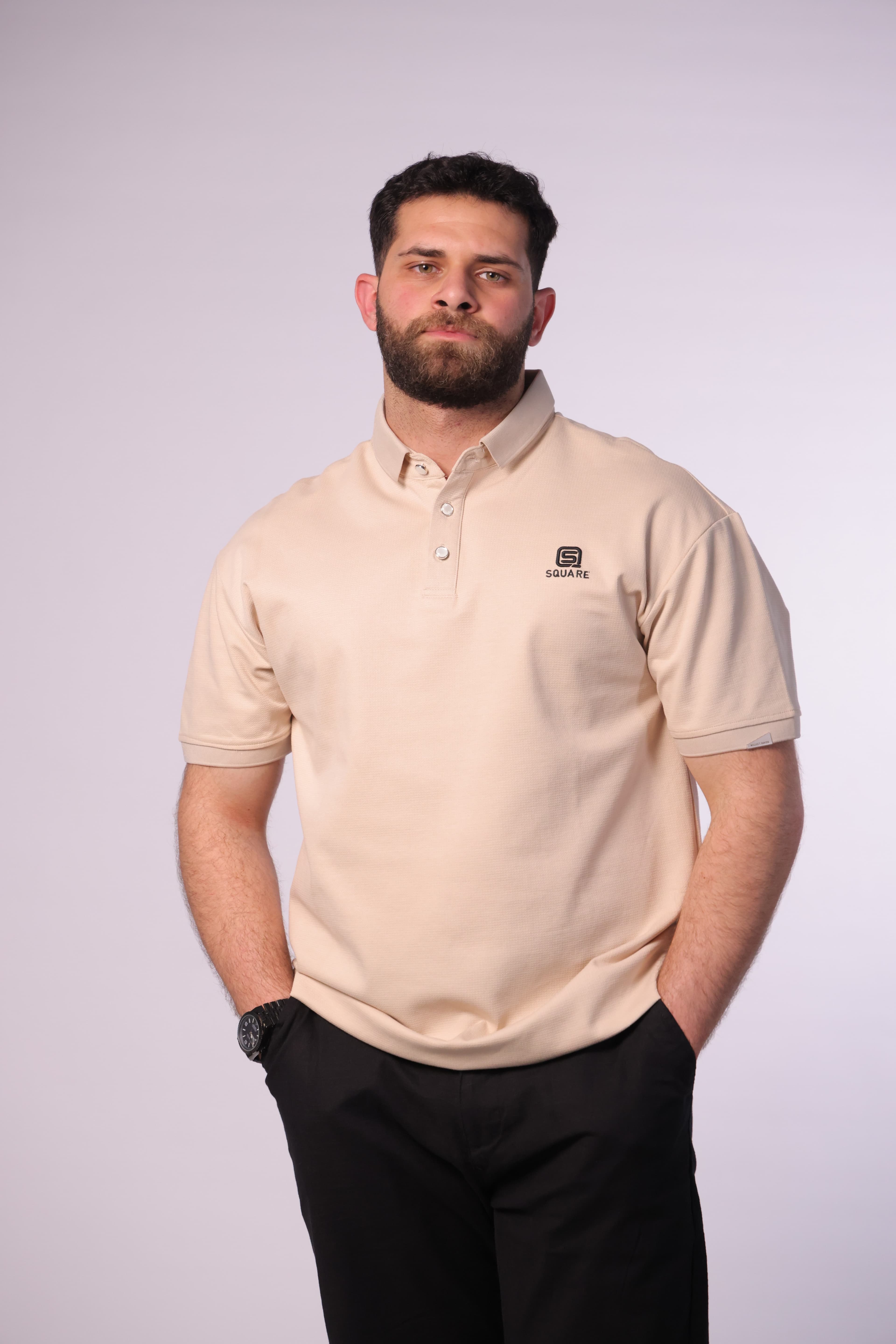 Regular-Fit Beige Polo Shirt - Slim-fit beige polo shirt designed for a clean, refined look. Featuring a classic collar with a button placket and subtle chest logo detail for a minimal touch. Crafted from soft, breathable fabric that ensures all-day comfort while maintaining a sharp silhouette—perfect for smart-casual outfits or everyday elevated style.