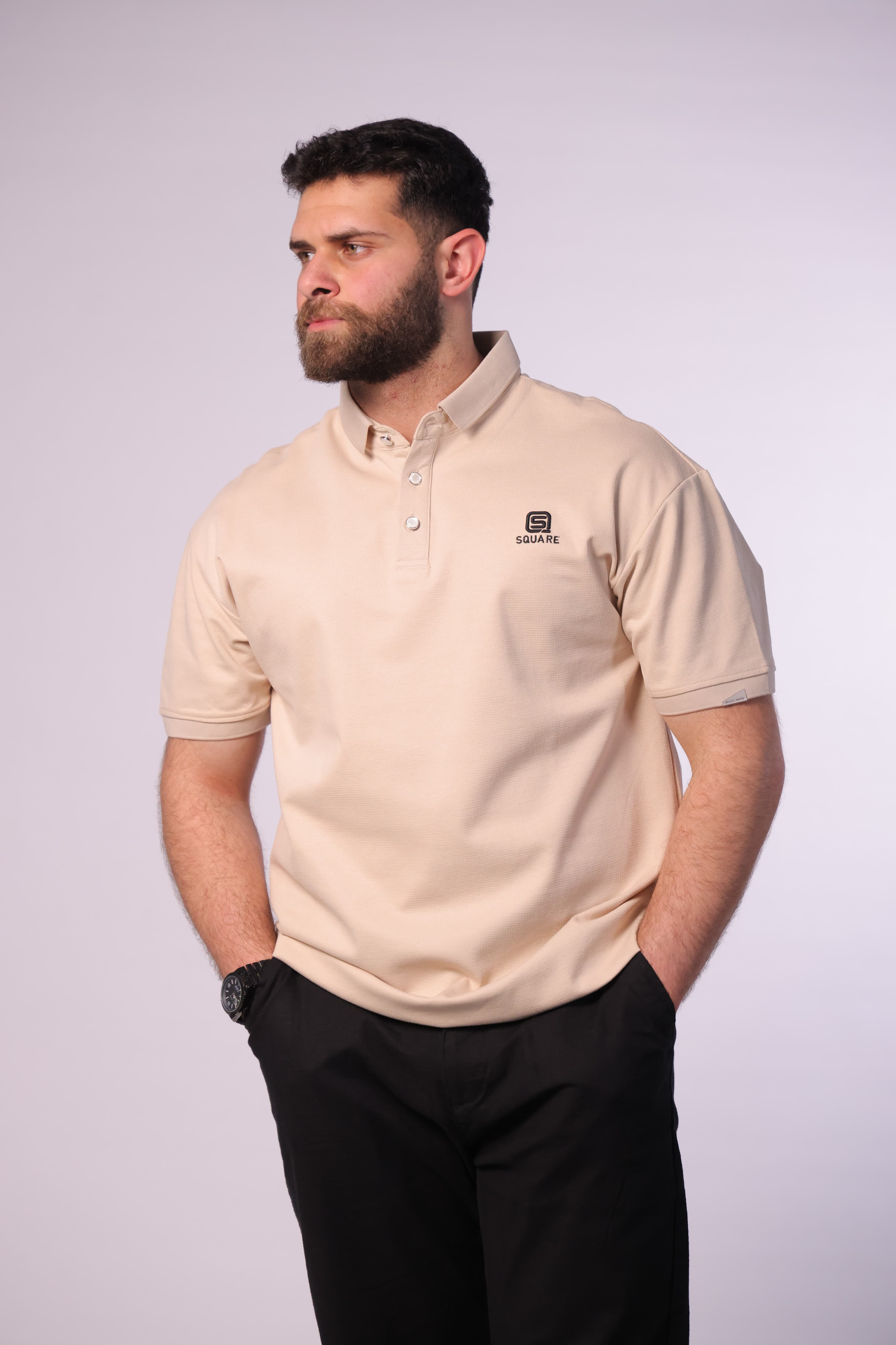 Regular-Fit Beige Polo Shirt - Slim-fit beige polo shirt designed for a clean, refined look. Featuring a classic collar with a button placket and subtle chest logo detail for a minimal touch. Crafted from soft, breathable fabric that ensures all-day comfort while maintaining a sharp silhouette—perfect for smart-casual outfits or everyday elevated style.