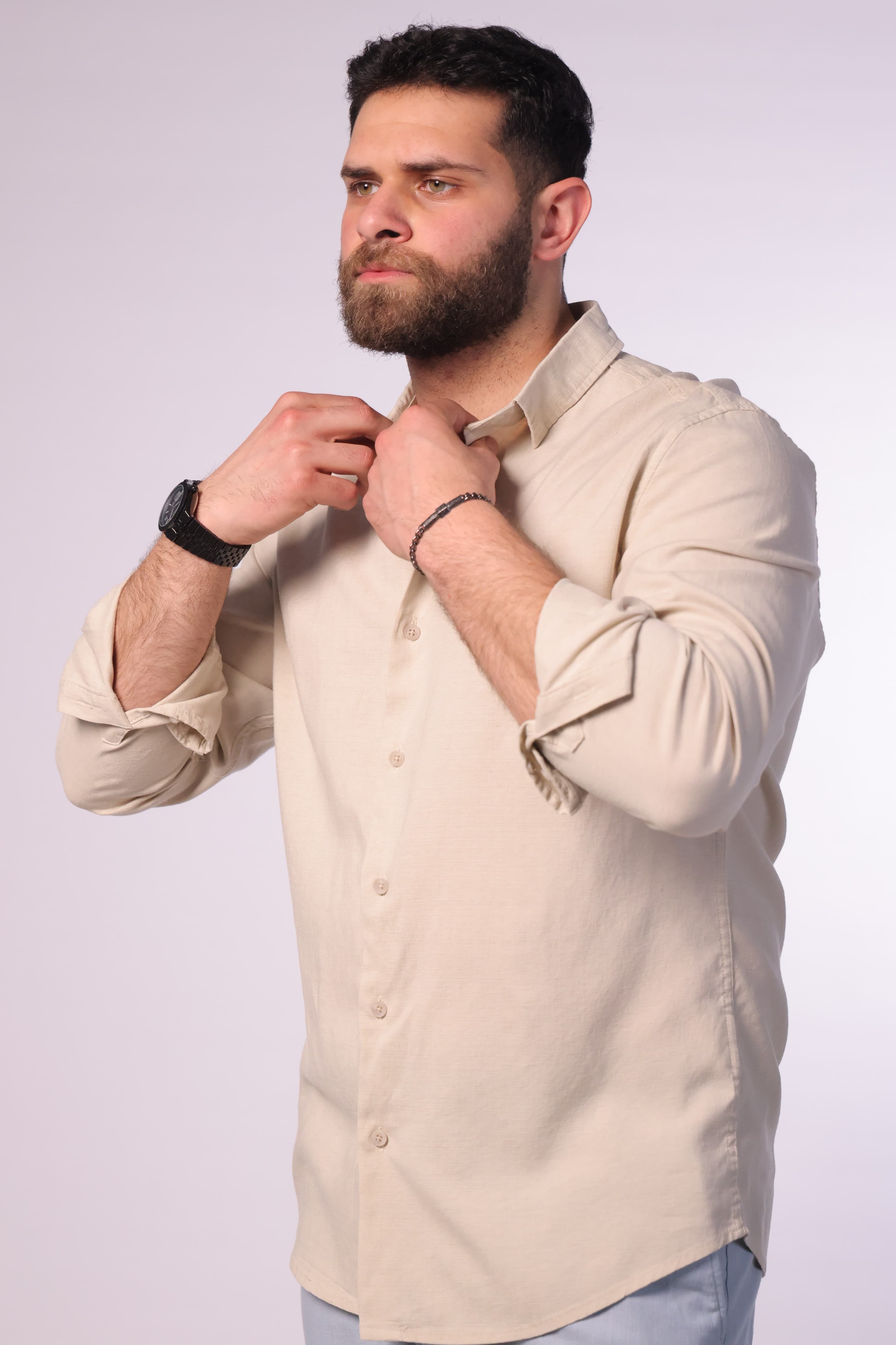 Regular-Fit Beige Button-Down Shirt - Regular-fit beige button-down shirt designed for a clean and refined look. Featuring a classic collar, full button closure, and a minimal, smooth finish for a timeless style. Crafted from lightweight, breathable fabric that offers all-day comfort while maintaining a sharp silhouette—perfect for smart-casual outfits or dressed-up everyday wear.
