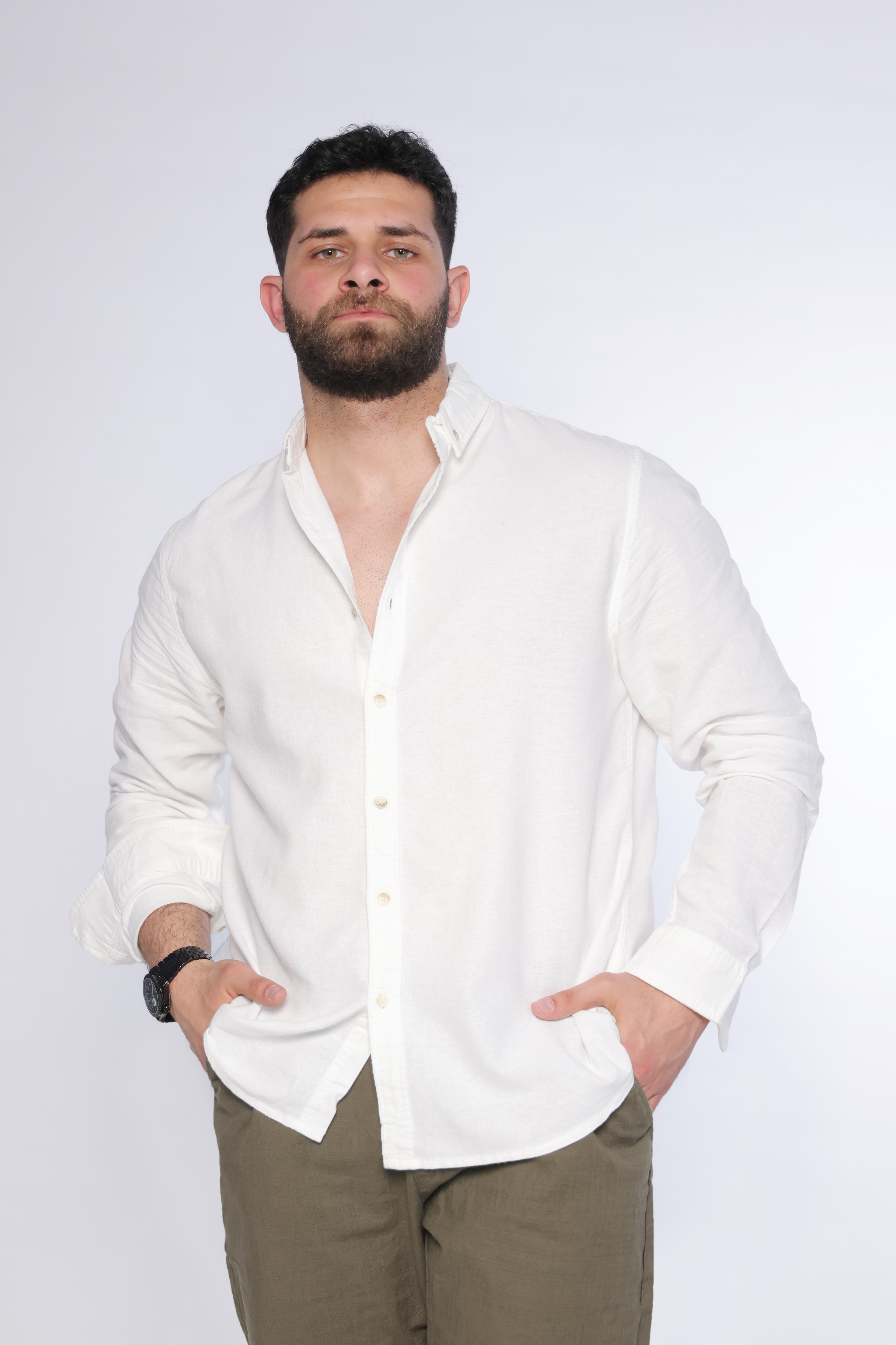 Relaxed-Fit Button-Down Shirt - Relaxed-fit white button-down shirt designed for a clean and effortless look. Featuring a classic collar, full button closure, and a soft, slightly textured fabric that adds a natural feel. Crafted from lightweight, breathable material for all-day comfort, making it perfect for smart-casual outfits or laid-back everyday styling.