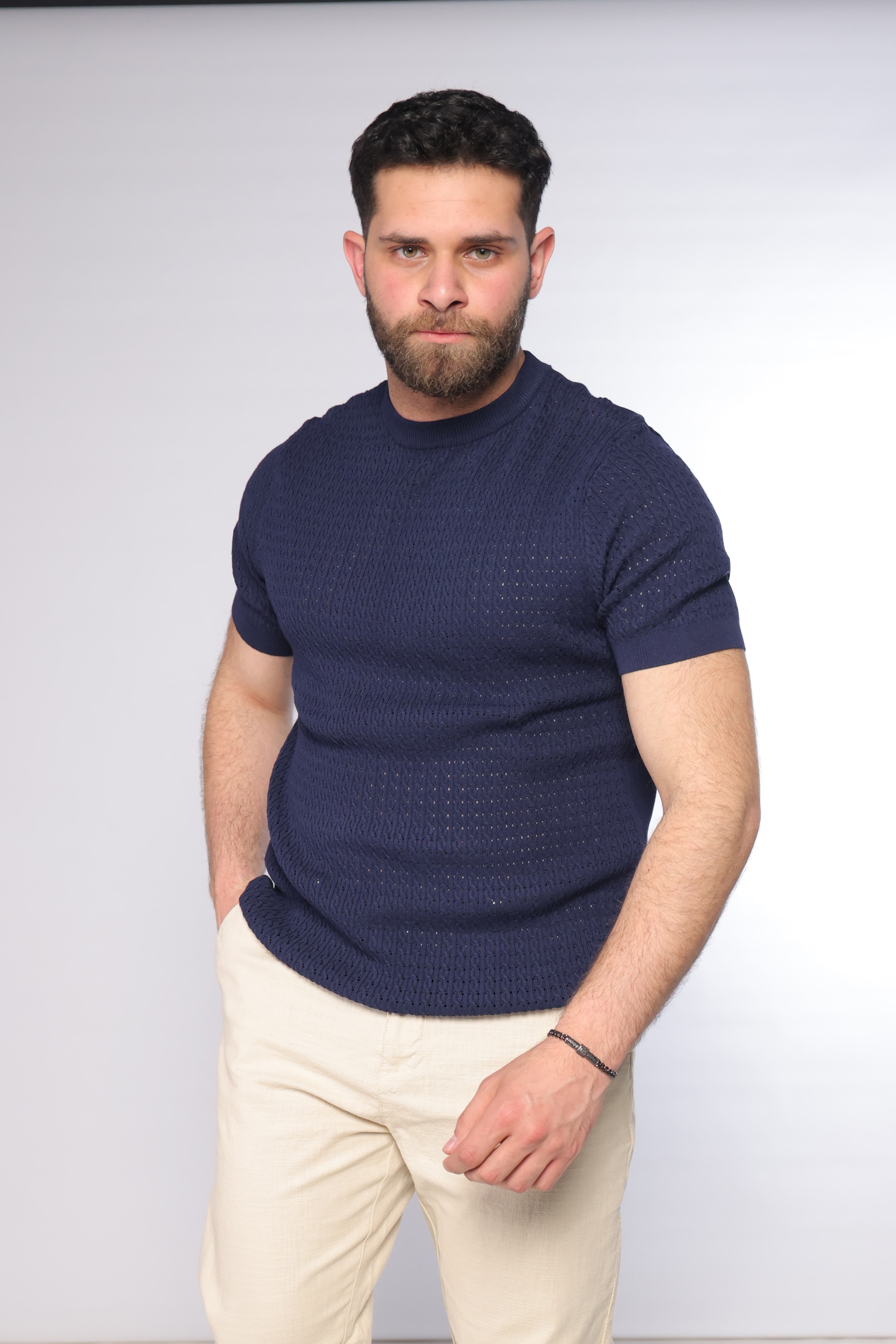 Slim-Fit Navy Knitted T-Shirt - Slim-fit navy knitted t-shirt featuring a textured open-knit pattern for a refined, breathable feel. Designed with a clean crew neckline and fitted short sleeves that enhance the silhouette. Crafted from soft, lightweight fabric, making it perfect for smart-casual looks or elevated everyday styling with a modern edge.