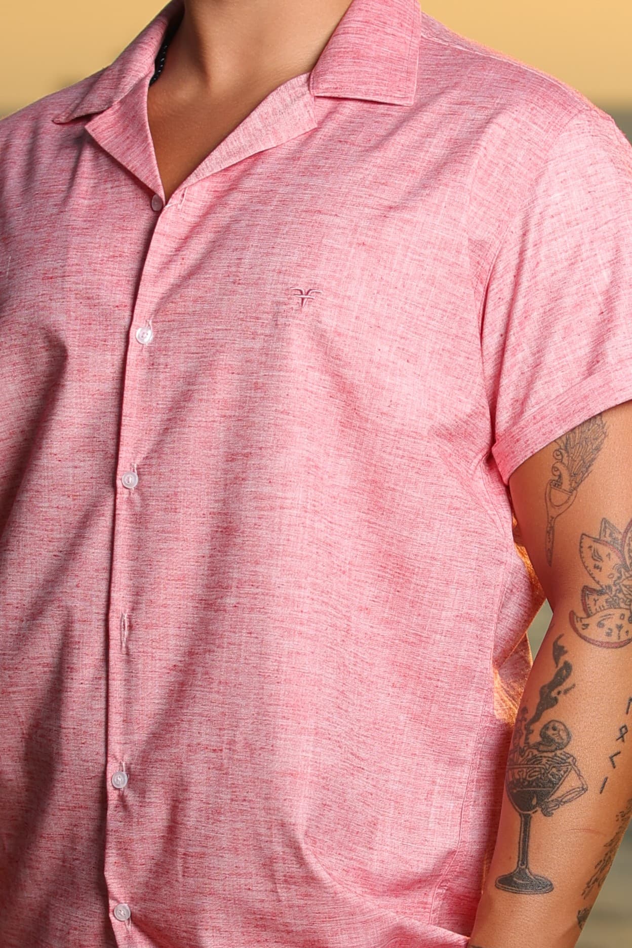 Relaxed-Fit Button-Down Shirt Coral Pink - Relaxed-fit short sleeve button-down shirt in a fresh coral pink tone, featuring a lightweight textured fabric for a breathable, summer-ready feel. Designed with an open camp collar and clean front closure for a laid-back yet refined look. Perfect for warm-weather styling, whether paired with shorts or light trousers for a smart-casual coastal vibe.