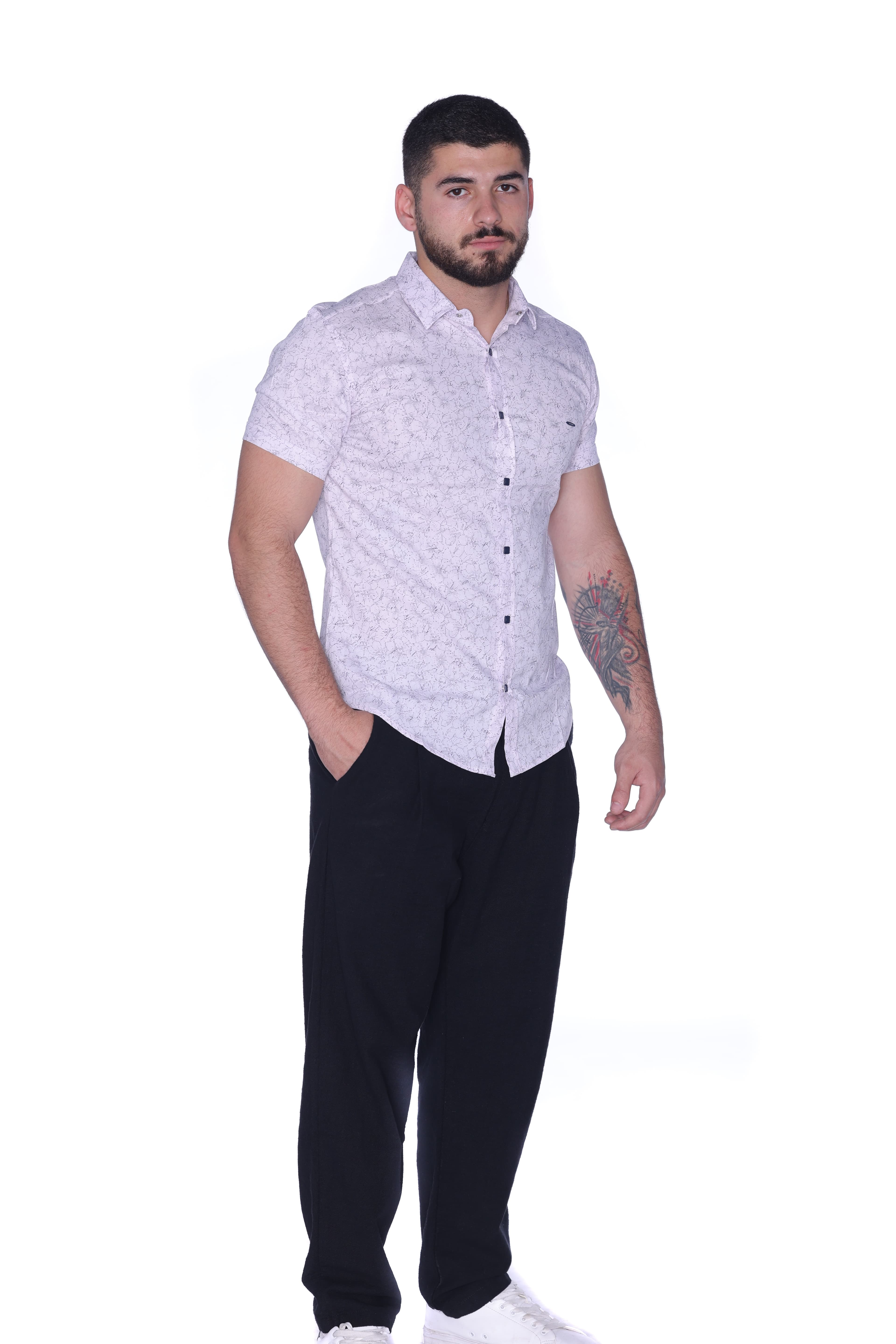Slim-Fit Button-Down Shirt Light Pink - Slim-fit short sleeve button-down shirt in a light pastel tone, featuring a subtle all-over micro pattern for a refined and modern look. Designed with a sharp collar, clean front closure, and contrasting dark buttons for added detail. Crafted from lightweight, breathable fabric that ensures comfort while maintaining a sleek silhouette—perfect for smart-casual outfits or polished everyday wear.